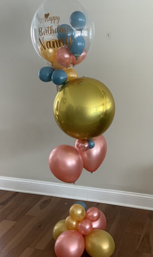 HBD balloons with orbs and clear balloon with mini inside