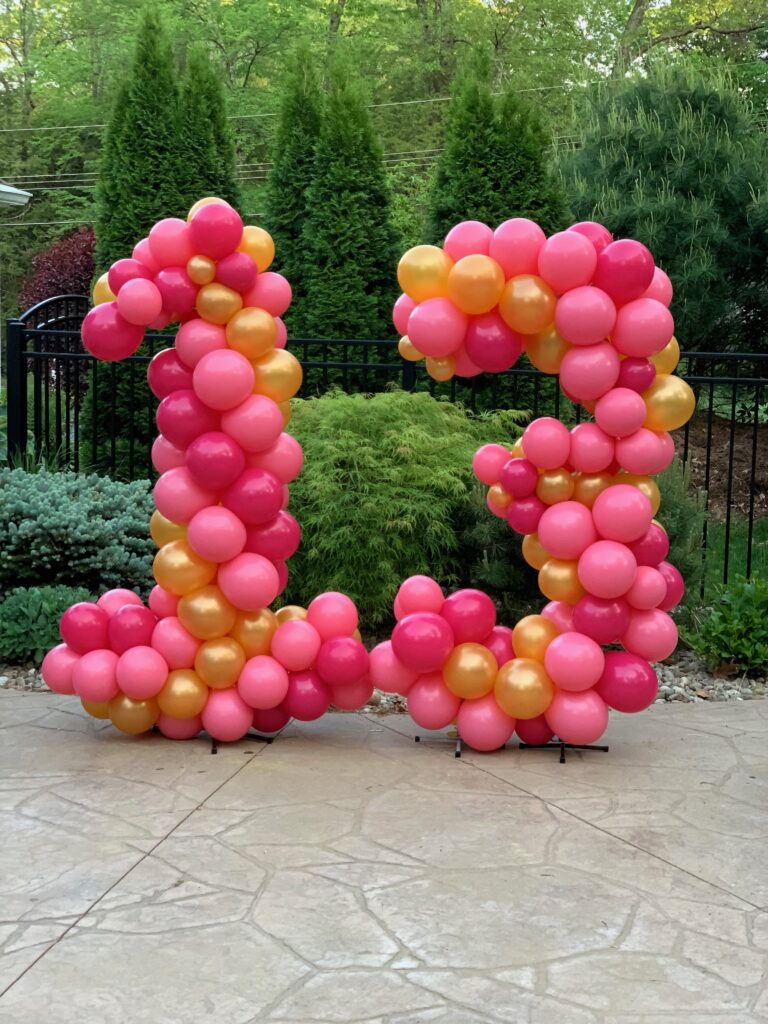 13 pink gold balloons