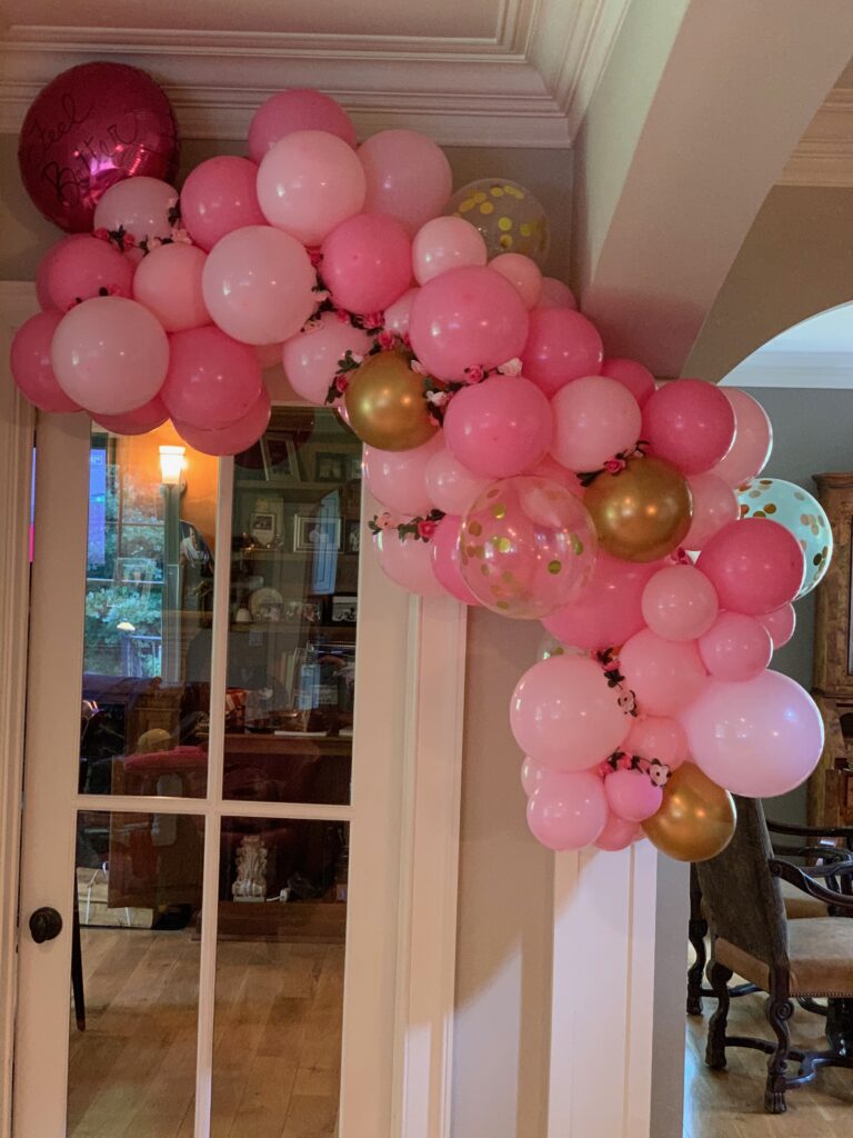 pink organic balloon garland with flowers